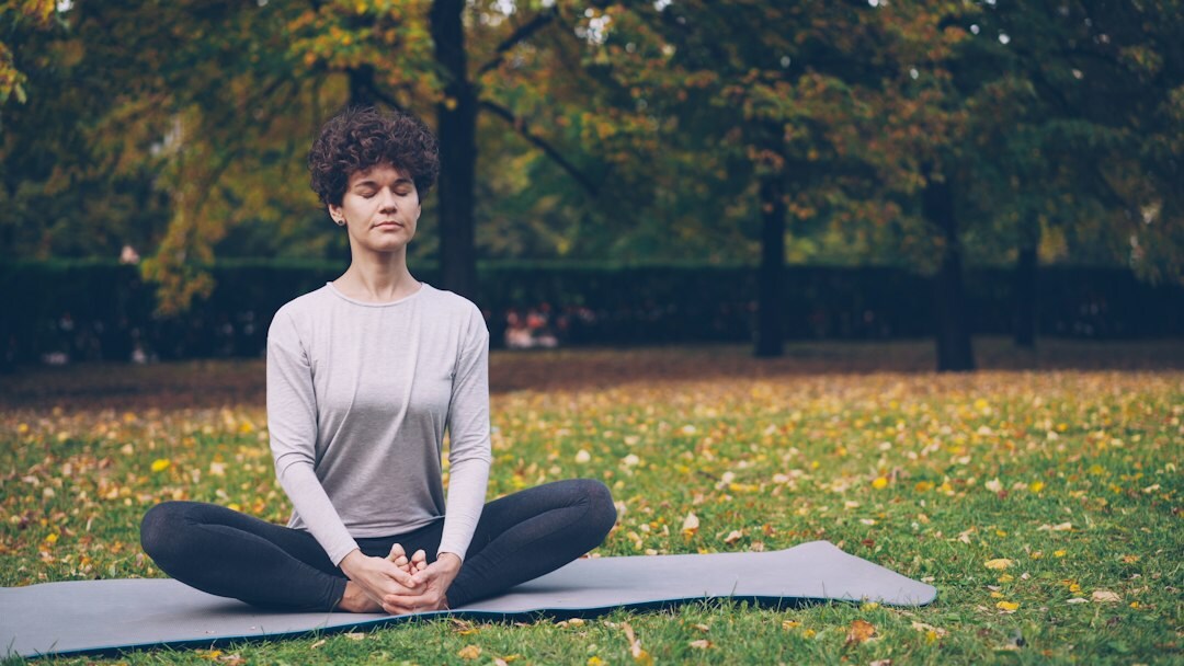 woman doing yoga in park